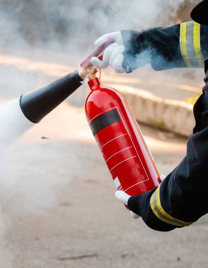 Man Conducts Exercises With Fire Extinguisher Fire Extinguishing Concept Fire Emergency Incident
